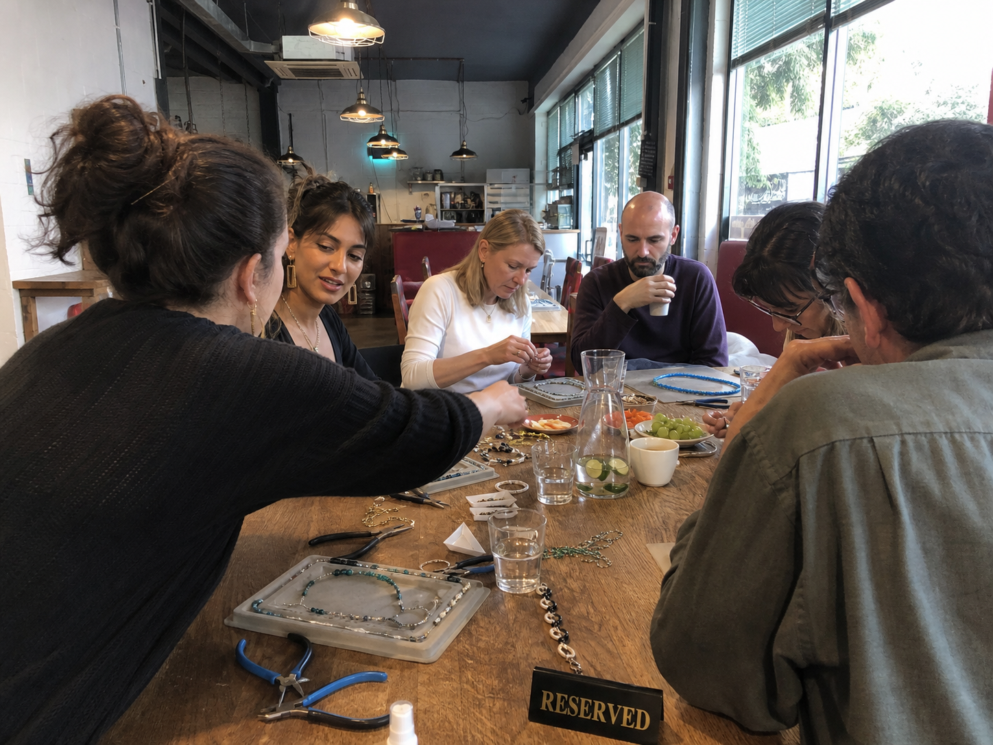 Jewellery workshop around a wooden table
